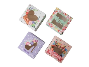 Top view of four assorted Mother's Day cookie gift boxes with floral and heart patterns