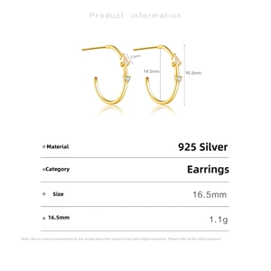 Detail view of 925 sterling silver C-shaped gold hoop earrings with drop zirconia stones