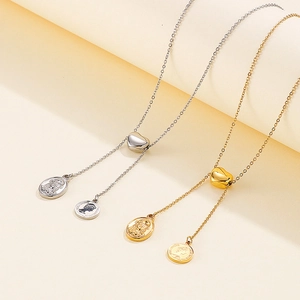 Gold and silver heart slider Y-necklaces with Mary and Jesus embossed coin pendants