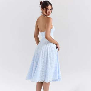Detail of light blue halter backless dress with textured floral jacquard fabric