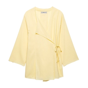 Women light yellow linen wrap kimono top and wide leg pants two piece set in flat lay