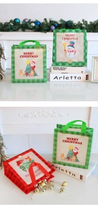 Detail of Christmas non-woven gift bags with festive Santa and snowman plaid patterns