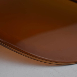 Macro detail of the smooth amber leopard print brim with translucent resin texture