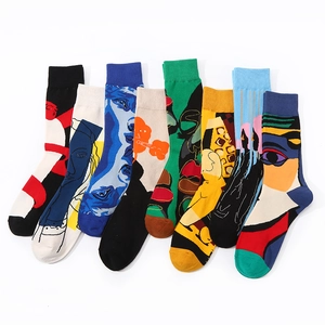 Abstract Picasso style mid-calf cotton socks with colorful face patterns on white background
