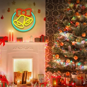 LED Christmas bell neon sign with red bow hanging on wall near a festive tree