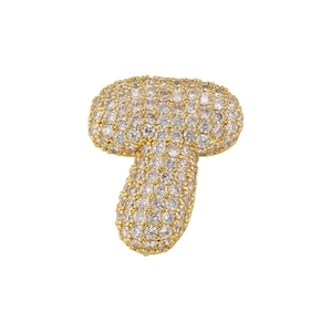Close-up of gold-plated copper pendant with micro-paved cubic zirconia letter design