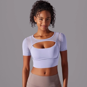 Detail of lavender mesh patchwork and front cutout on women's athletic short sleeve top