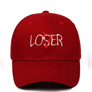 Close-up of LOSER text embroidery with red V overlay on burgundy rock baseball cap