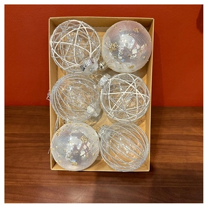 Detail view of 6 champagne mesh tulle Christmas balls in a kraft paper box