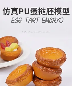 Detailed view of 7.5cm PU egg tart models featuring realistic baked textures and soft foam