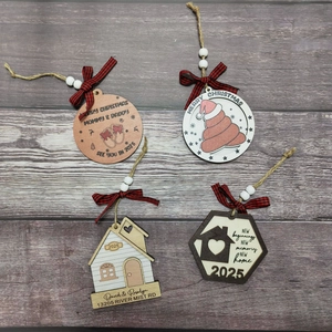 Custom wood Christmas house ornaments with plaid bows on dark wood background