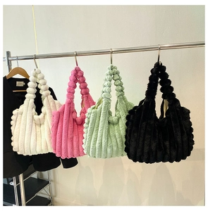 Detailed view of plush tote bags with vertical stripes in white, pink, mint, and black