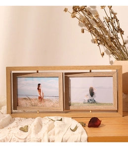 Double-sided rotating wooden photo frame showing landscape photos as home decor
