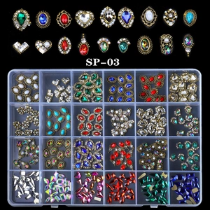 24-grid set of mixed nail art rhinestones and crystal charms in a clear storage box