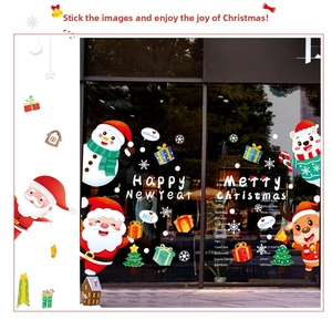 Detailed Christmas window stickers with Santa, reindeer, and snowflakes on a glass door