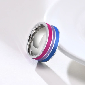 Macro view of polished stainless steel ring featuring bisexual pride flag stripes