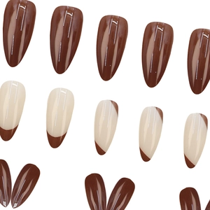 Silver wavy pointed press-on nails in mocha brown and cream white with mirror finish