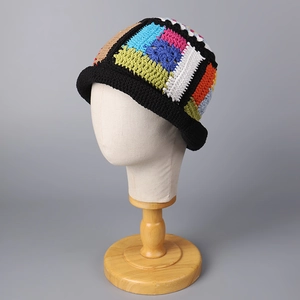 Detailed view of colorful handmade crochet knit texture on a stylish summer bucket hat