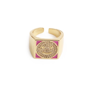 Detail view of pink enamel smiley face ring with gold plating and cubic zirconia