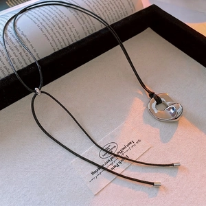 Minimalist silver irregular round pendant necklace with adjustable black leather cord