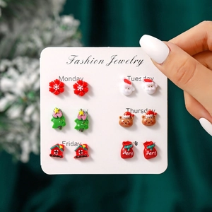 Detailed set of six resin Christmas stud earrings featuring Santa, reindeer, and snowflakes