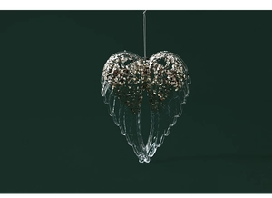 Detailed view of clear acrylic angel wing ornament with sparkling gold glitter accents