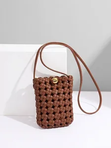 Vertical woven leather phone bag in brown with minimalist golden sphere buckle