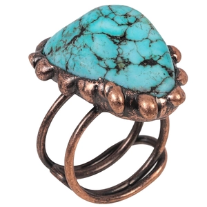 Vintage copper ring featuring an irregular raw turquoise stone with natural black matrix