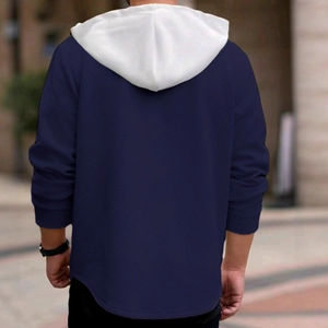 Men's navy blue hooded sweatshirt featuring white color-block hood and textured fabric