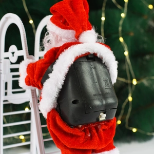 Close-up of the battery compartment and power switch on the electric Santa decoration