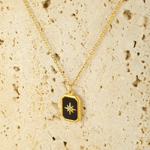 Elegant gold plated stainless steel necklace featuring a starburst rectangle pendant