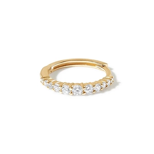 Macro shot of gold S925 sterling silver hoop earring with sparkling pavé cubic zirconia