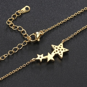 Elegant gold star pendant necklace with three zircon charms and adjustable lobster clasp