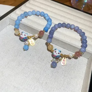 Lucky cat charm bracelets with natural blue and purple beads and white pearls