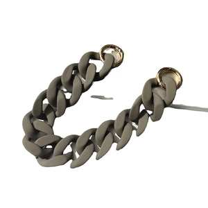 Grey matte acrylic chain strap with gold metal rings on white background for women's bags