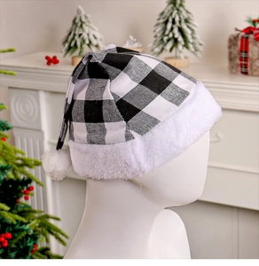 Close-up of black and white plaid Christmas hat with plush trim on a model by fireplace