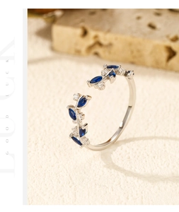 Close-up of S925 silver leaf ring with marquise blue gems and sparkling white diamonds