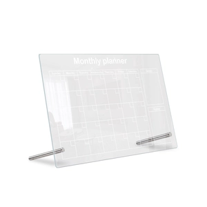 Detail of transparent acrylic monthly planner board with metal stands and goals section