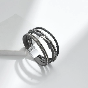 Multilayer PU leather bracelet with gray beads and crystal cross charm on white background