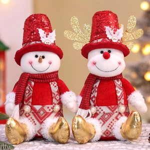Detail of Christmas snowman plush dolls with red sequins and festive knitwear costumes