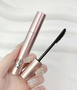 Detail showing Roto rose gold mascara wand and brush head for length and volume