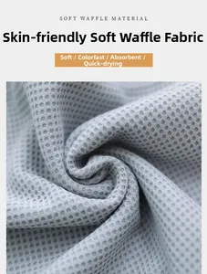Detail of skin-friendly grey waffle fabric showing high absorbent and fast-drying texture