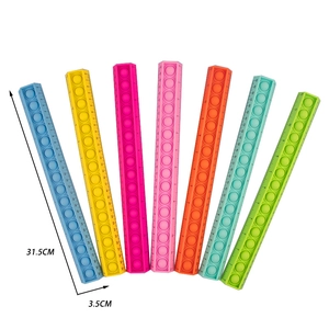 Seven colorful silicone pop-it sensory rulers for stress relief with 30cm scale marking