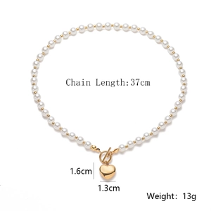 Detail view of pearl necklace with gold heart pendant and dimensions 37cm length