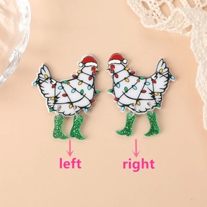 Detail of Christmas chicken earrings with festive hats, green boots and light strings