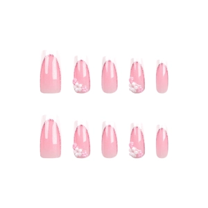 Long square French tip press-on nails with pink gradient, glitter, and 3D floral accents