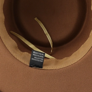 Detail view of the brown wool fedora interior showing the cotton blend lining and sweatband