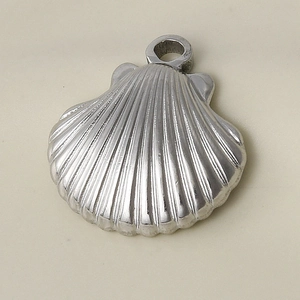 Detailed macro shot of silver 304 stainless steel seashell pendant for DIY jewelry