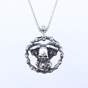 Punk rocker skull pendant with V-twin engine and motorcycle chain in retro silver