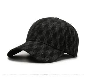 Detail of dark grey baseball cap featuring textured 3D geometric woven fabric pattern